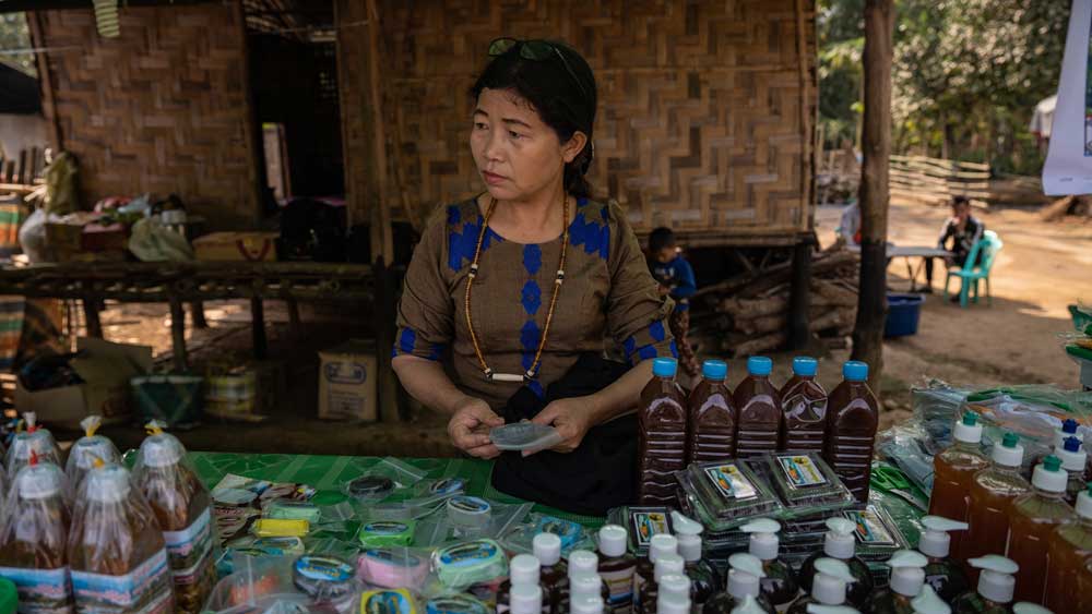 Local activist Daw Ja Khom runs a stall to raise money for the community and promote traditional culture in the face of great change. Photo: RFA