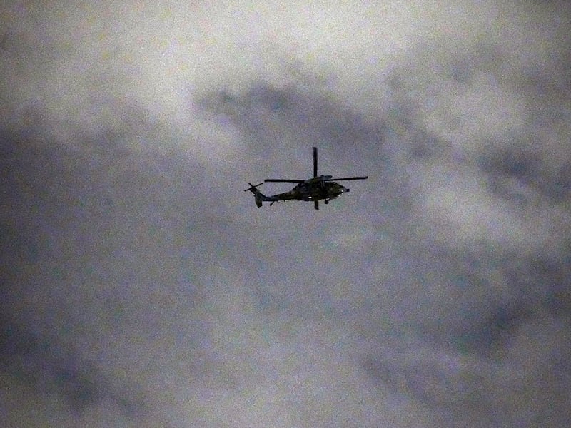 A helicopter flies over the National Assembly in Seoul, Dec. 4, 2024.