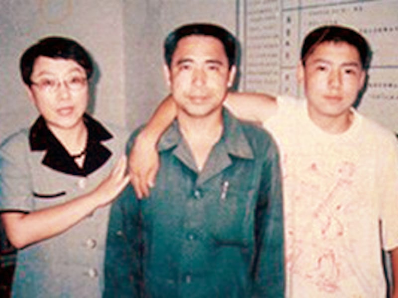 Mongolian dissident Hada, center, his wife and fellow activist Xinna, left, and son Uiles, undated photo.