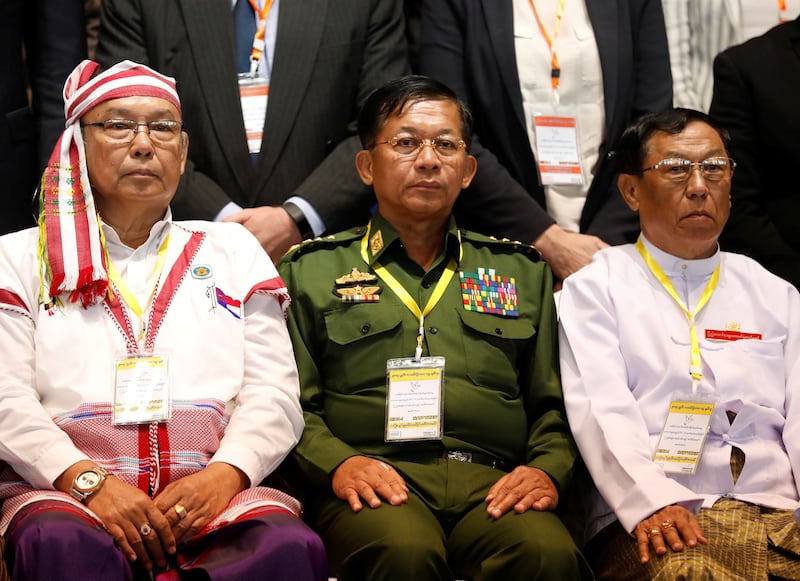 Myanmar's Commander in-Chief Senior General Min Aung Hlaing (C) poses for a photo during the second anniversary of the Nationwide Ceasefire Agreement (NCA) in Naypyidaw, in a file photo. Credit: Reuters