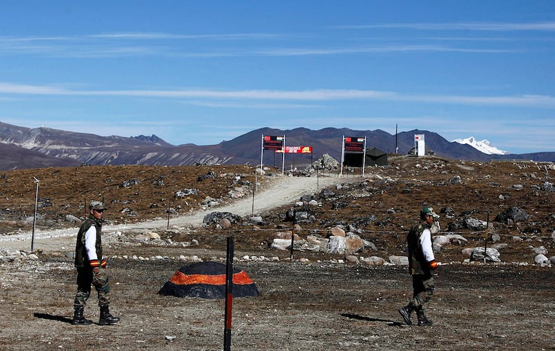 Indian army soldiers walk along the line of control at the India-China border in Bumla in Arunachal Pradesh, Oct. 21, 2012. (Anupam NathAP)