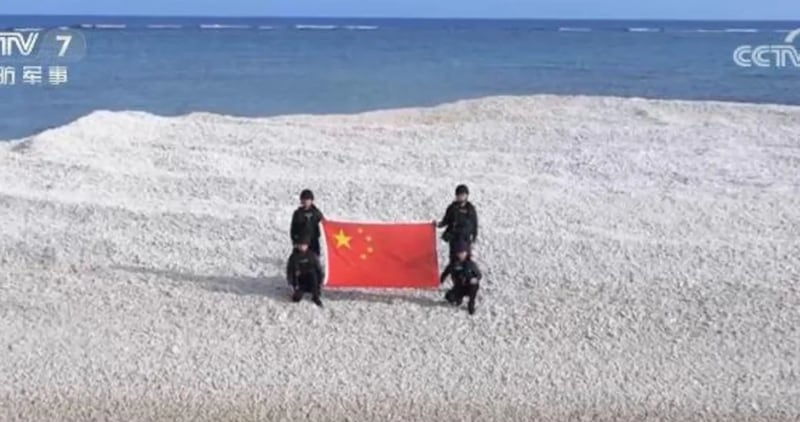 Chinese state media released a photo of coast guard officers on the disputed reef.