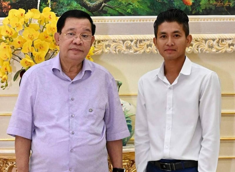 Former political activist Muong Sony, who has joined the Cambodian People's Party, poses with Cambodian leader Hun Sen. Credit: Citizen journalist
