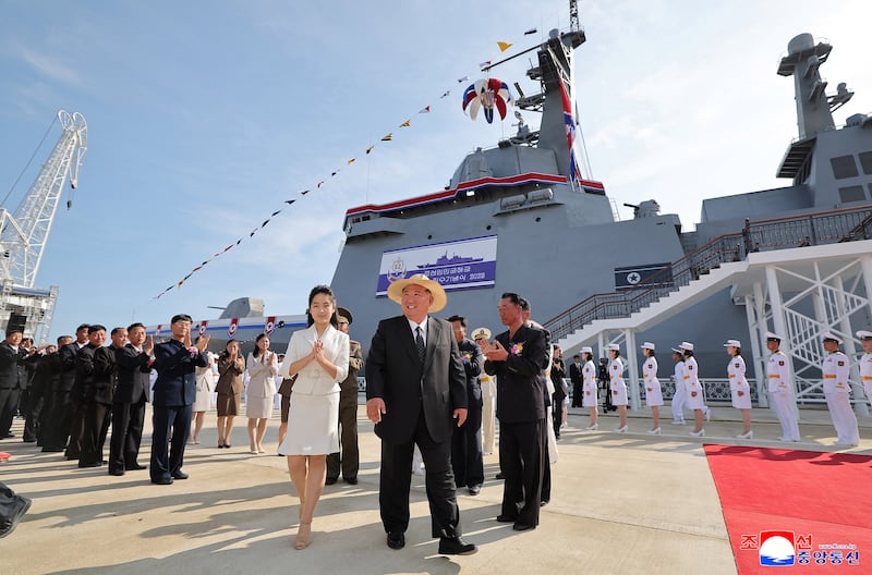 This image released by the North Korean government on June 12, 2025, and not independently verified shows North Korean leader Kim Jong Un and daughter Kim Ju Ae attending the launching ceremony of the repaired navy destroyer in Rajin, North Korea.
