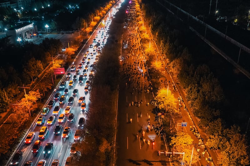 Thousands of college students ride bicycles on the Zhengkai Road in Zhengzhou, in China's Henan province, Nov. 9, 2024.