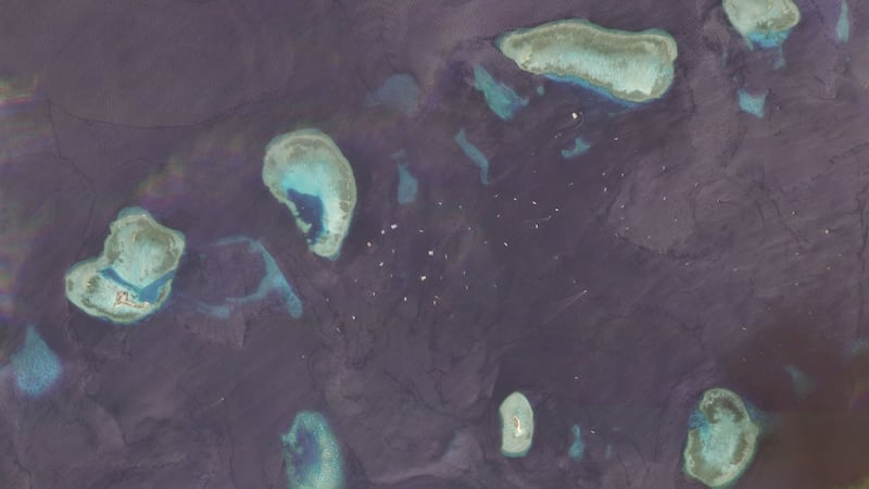 The Union Banks as of Sept. 26, 2020. Hundreds of fishing vessels are in the area at any given time, with ship-tracking data showing China's maritime militia among them. The upper left shows China's Hughes Reef, while Vietnam's Sin Cowe East outpost is visible in the lower right.