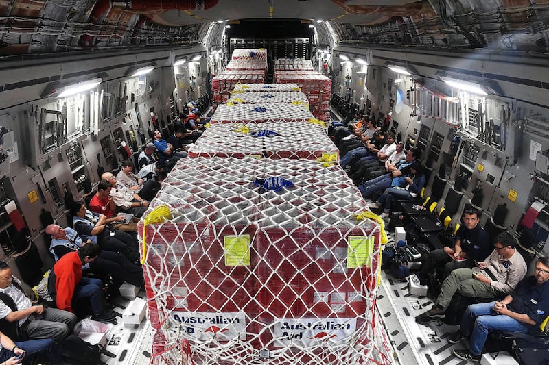 Australian defense force, emergency services personnel and relief supplies onboard an Australian Air Force C-17A Globemaster cargo plane en route Port Vila, Vanuatu, March 16, 2015.